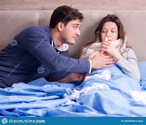 Wife Caring For Sick Husband At Home In Bed Stock Image Image Of Cold