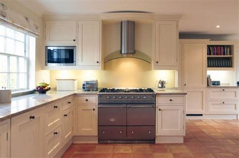 White kitchen cabinets fit any decor. ivory fantasy granite with white cabinets - Google Search | Kitchen cabinets, Home, White cabinets