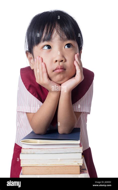 Asian Little Chinese Girl With Piles Of Books In Isolated White