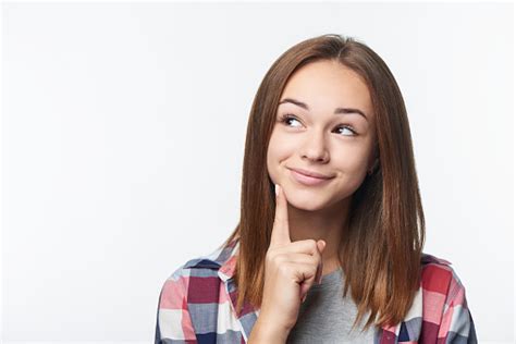 Closeup Portrait Of Thinking Teen Girl Looking To Side Stock Photo