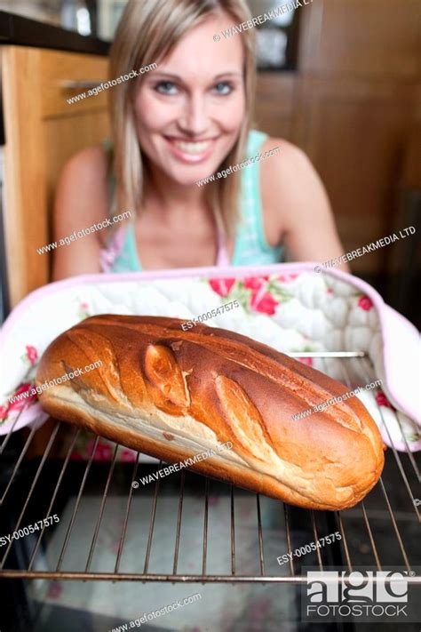 Happy Woman Baking Bread In The Kitchen Stock Photo Picture And Low