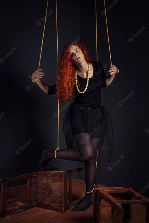 Premium Photo Halloween Redhead Woman Marionette Doll Tied With Ropes Girl Doll Tied With