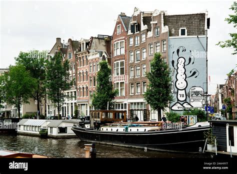 amsterdam canal street art including barge netherlands prinsengracht number 70 a mural by the