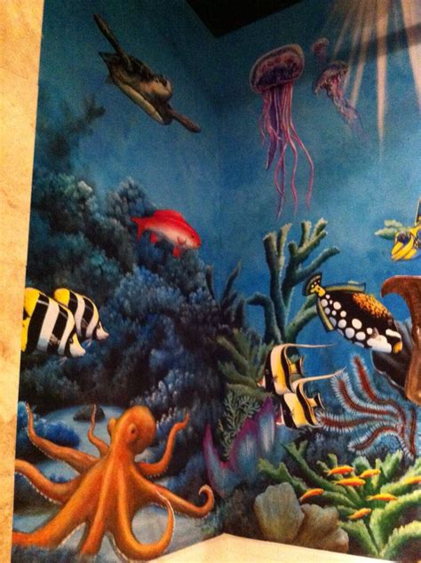An Underwater Scene Painted On The Side Of A Wall With Sea Animals And
