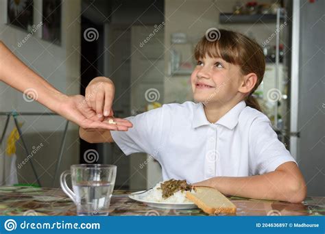 Mom Gives The Girl Medicine To Take Before Lunch Stock Image Image Of Balanced Second