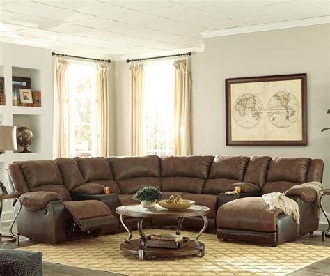 Sectional can be detached into a love seat and chaise. Signature Design by Ashley Nantahala Faux Leather ...
