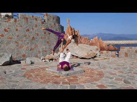Couple Perform Acro Yoga At Popular Location In Sardina Jukin Licensing