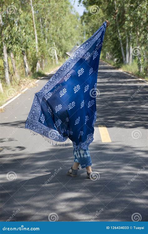 Thai Women Posing Relax And Playing Indigo Tie Dye Fabric Shawl On The Small Street In