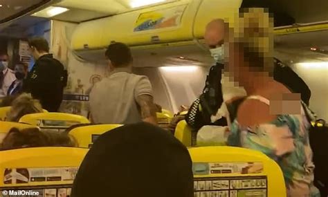 Moment Police Haul Rude Ryanair Passenger Off Flight From Portugal Daily Mail Online