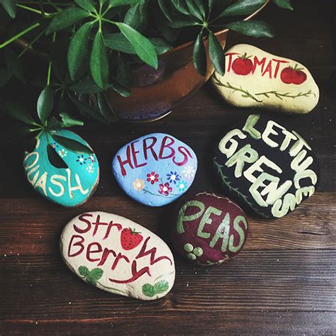 The bottom has been left unpainted. DIY Painted Garden Rocks - Party Inspiration