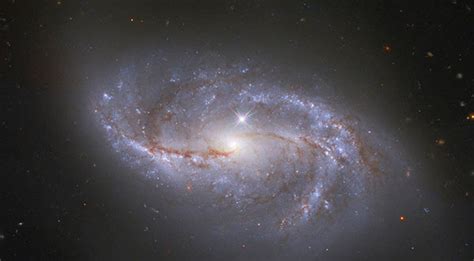 Meet ngc 2608, a barred spiral galaxy about 93 million light years away, in the constellation cancer. PHOTO OF THE DAY: NASA/ESA Hubble Space Telescope Glimpses ...