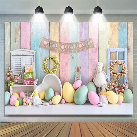 An Easter Scene With Pastel Colored Eggs And Bunnies In Front Of A