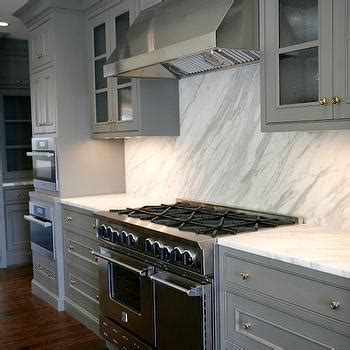 If you don't want any visibility but would like glass, frosted glass may be an option. Seeded Glass Door Fronts - Transitional - kitchen - Luxe ...