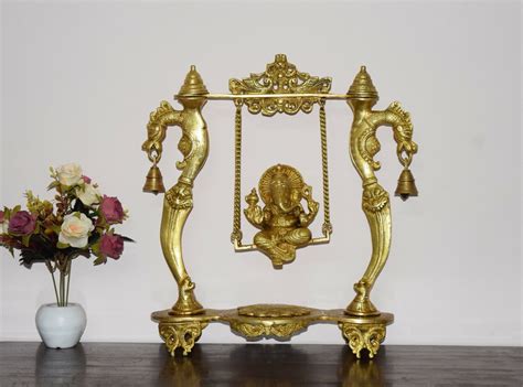 Brass Swinging Ganesha With Yali Crown And Ringing Bells Detachable