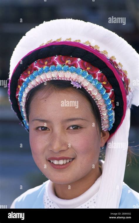 asia china yunnan dali city portrait of smiling girl dressed in traditional colourful bai