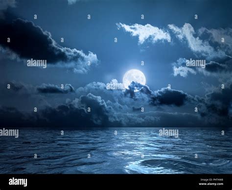 Full Moon Over The Ocean Stock Photo Alamy
