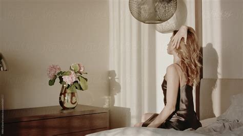 Beautiful Woman Waking Up In Sunny Morning By Stocksy Contributor