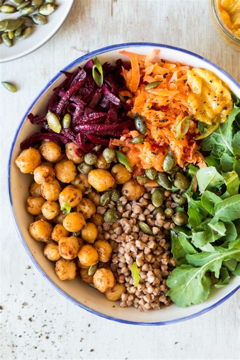 Vegan pumpkin lentil curry with spinach. Winter bowl with roasted pepitas - Lazy Cat Kitchen