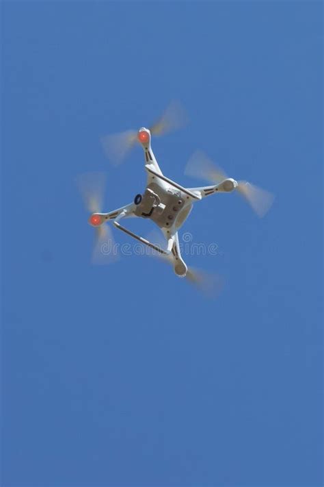 Drone Quad Copter With High Resolution Digital Camera On The Sky White