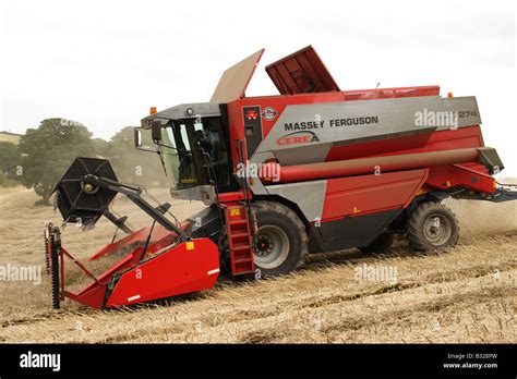 A Massey Ferguson Combine Harvester On A Uk Farm Stock Photo Alamy