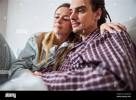 Beautiful Young Couple Cuddling In Bed At Home Stock Photo Alamy