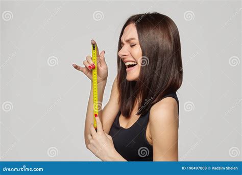 Beautiful Girl Holds A Measuring Tape In Her Hands The Concept Of