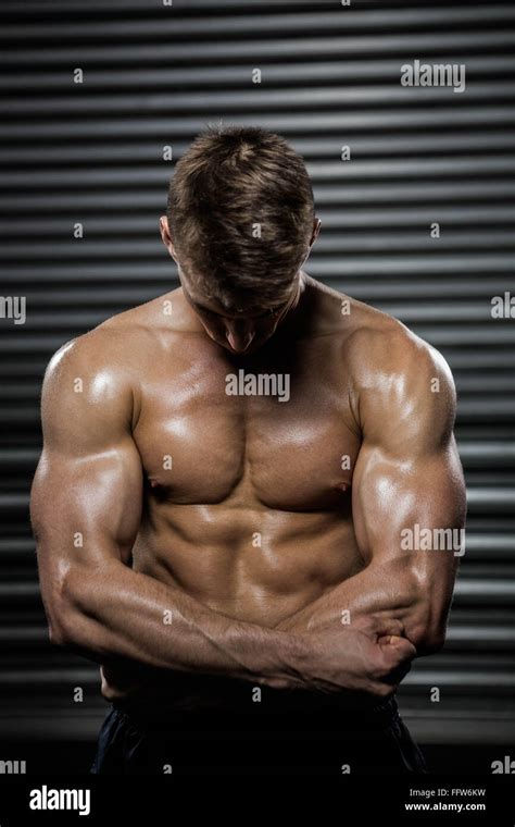 Shirtless Man Flexing Biceps Stock Photo Alamy