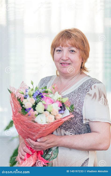 Beautiful Mature Woman With Bouquet Of Flowers Stock Image Image Of Happy European 145197233