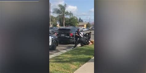 California Police Officer Seen Punching Woman In Face Before Fellow