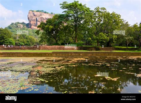 Horizontal View Of Sigiriya Or Lions Rock Reflected In The Water