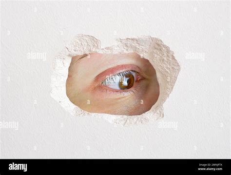 Eye Looking Wall Hole Close Up Trapped Stock Photo Alamy