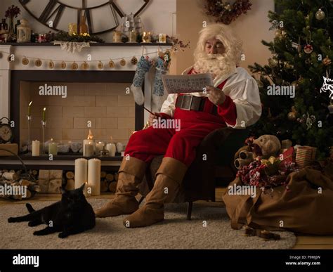 Santa Claus Resting At Home Near Christmas Tree Stock Photo 92037425
