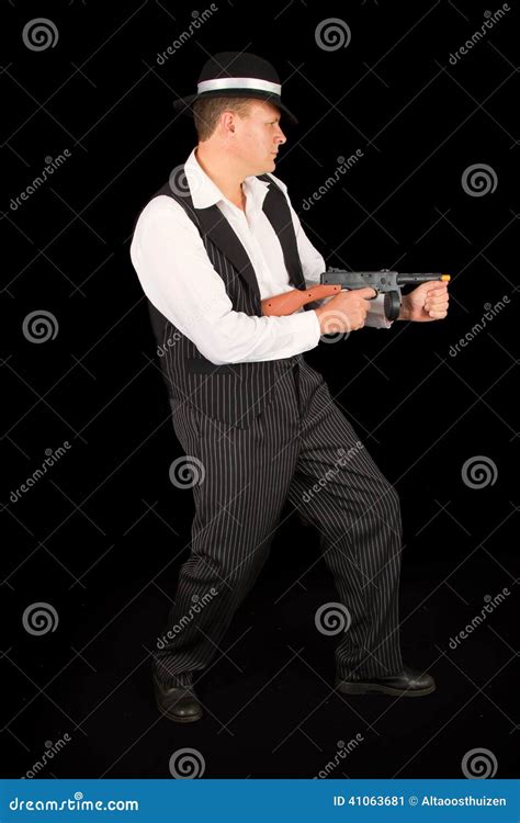 Dangerous Gangster With 1920 Style Clothes Standing With Gun Stock