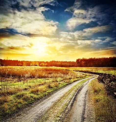 Sunset Over Winding Road In Field Stock Photo Image Of Dream Horizon