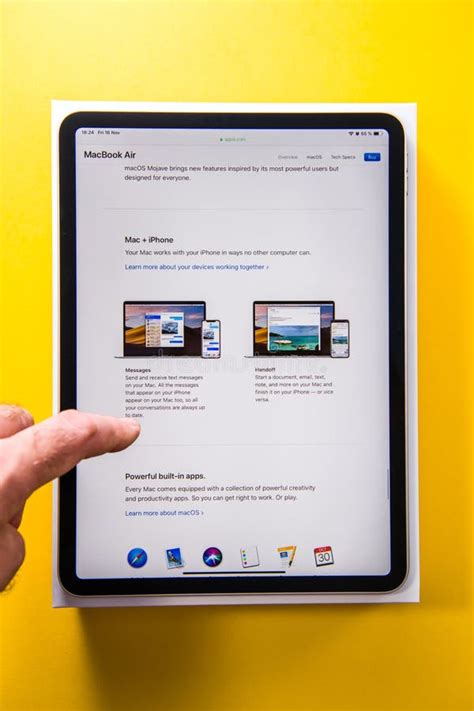 New Apple Computers Ipad Pro Tablet In Man Hand Yellow Backgroun