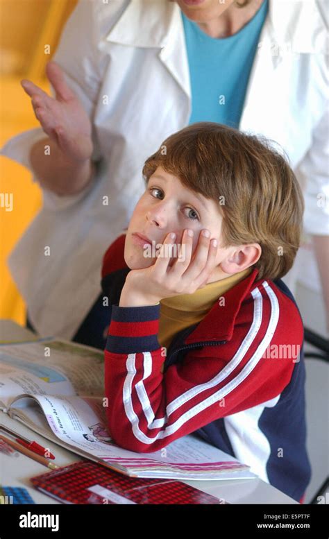 Mother Helping His 7 Year Old Son To Do His Homeworks Stock Photo Alamy
