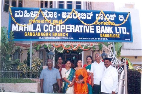 Simply snap a picture of the front and back of the check. Mahila Co-Operative Bank Ltd