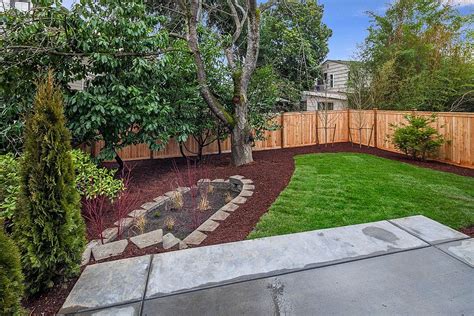 A lush rain garden in a small suburban chicago backyard saves water, reduces pollution and provides a lot of fun! Sunken rain garden? | Rain garden, Fall backyard, Backyard