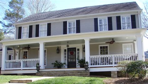 Great advice and photo of a vinyl lattice porch skirt on a new colonial style home with a farmers porch. colonial homes with front porches - Google Search ...