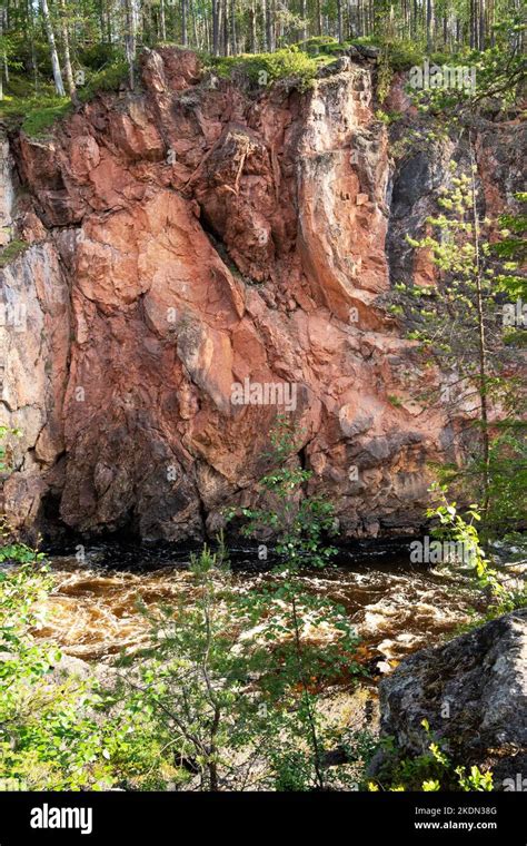 Red Limestone Wall Of Kiutaköngäs Rapids In Oulanka National Park