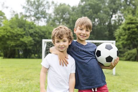 Two Brothers Having Fun Playing With Ball Stock Image Image Of Game