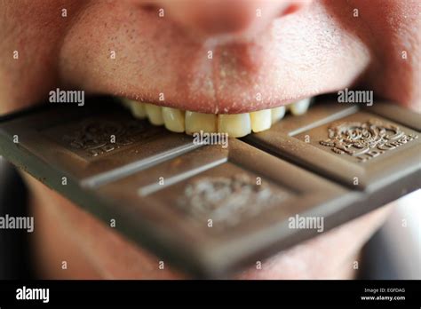 Male Eating Chocolate Stock Photo Alamy