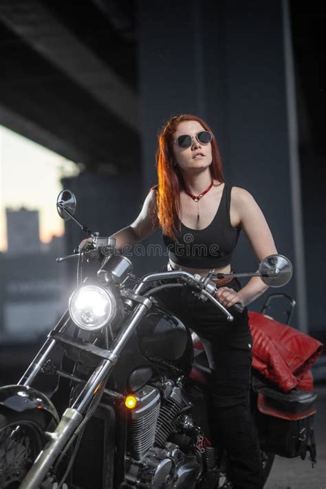 Girl Biker Sexually Posing On Motorcycle At Night City Stock Photo