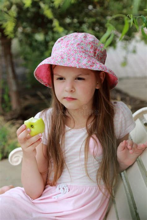 Little Girl Eating Green Apple Stock Photo Image Of Apple Herbs