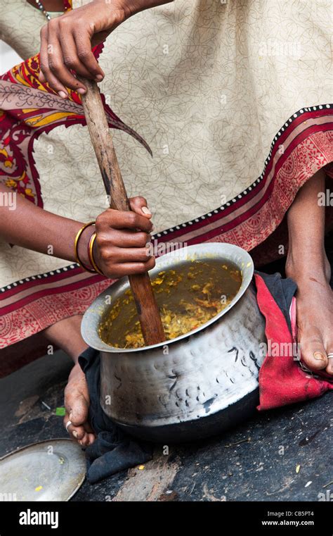 Woman In Traditional Dress Cooking Hi Res Stock Photography And Images