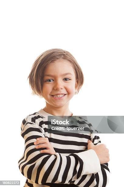 Confident Kid Smiling With Arms Crossed Stock Photo Download Image