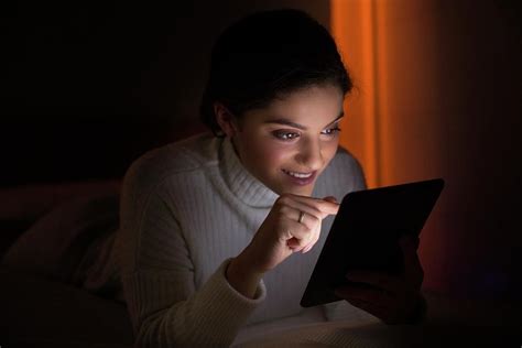 Woman Using Digital Tablet In Dark Room Photograph By Ian Hooton Science Photo Library Fine