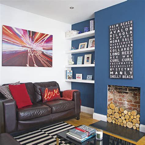 Living room with dark blue feature wall | Decorating | Ideal Home