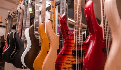 Close Up Of Electric Guitars In A Row In Huge Instrument Shop Music