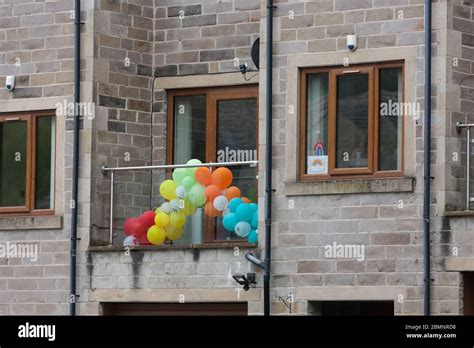 Balloons And Rainbows On Display On A Balcony In Support Of Frontline Workers In Holmfirth West